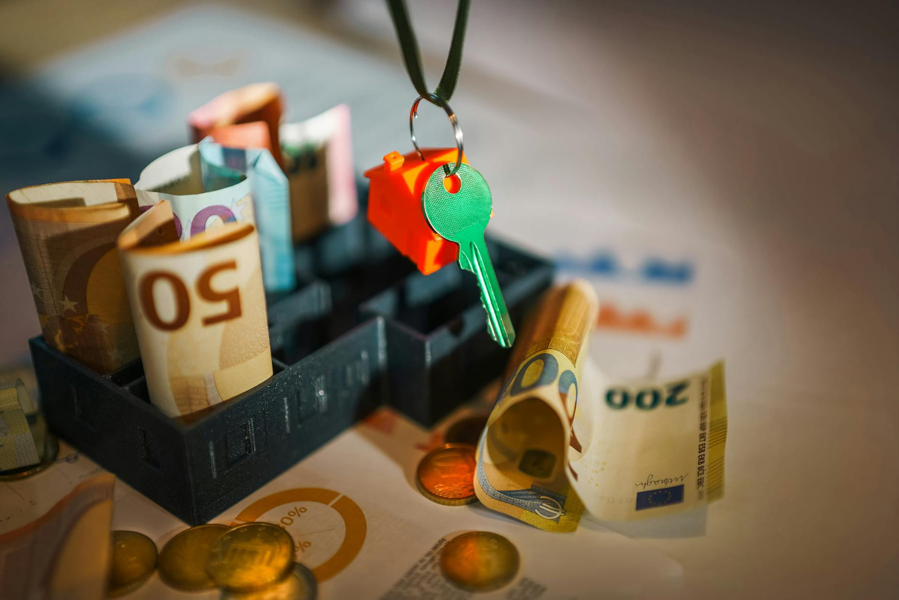 House key and euro bills depicting real estate and financial themes. on The Smart Home Buyer