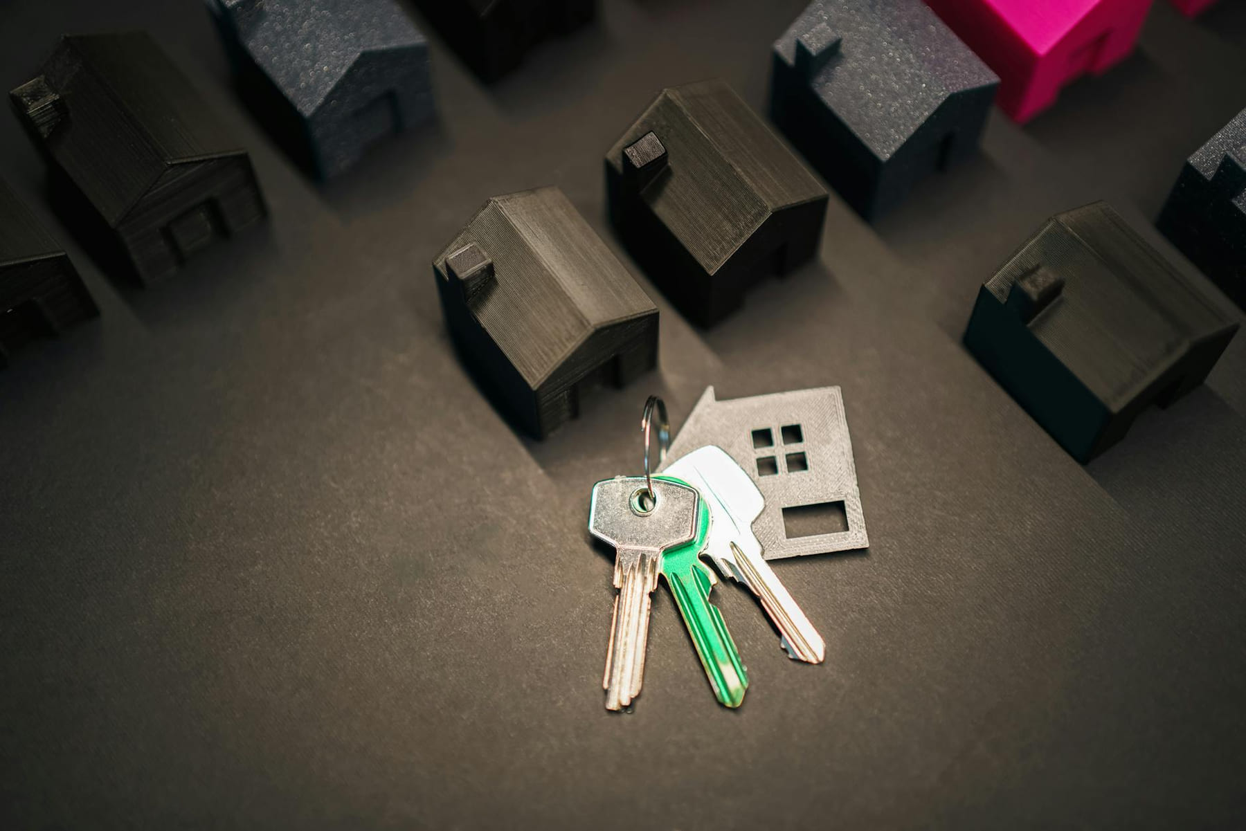 Miniature house models and keys symbolize real estate investment and housing market. on The Smart Home Buyer