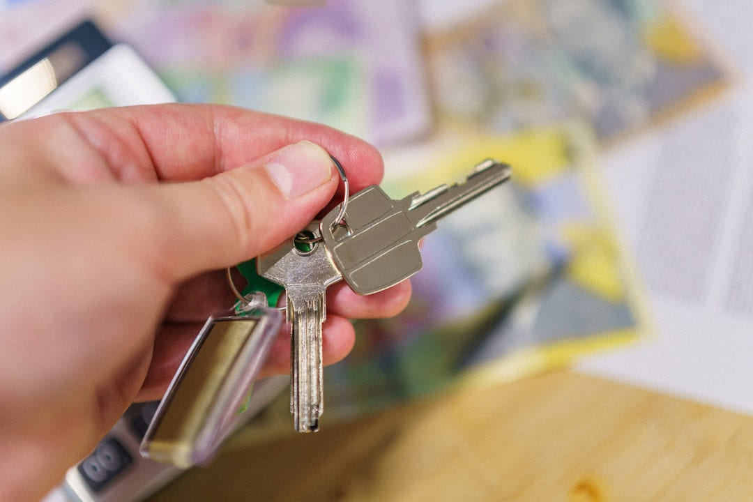 A person holding a bunch of keys in their hand on The Smart Home Buyer
