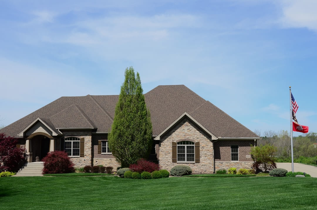 a house with a flag on the front lawn on The Smart Home Buyer